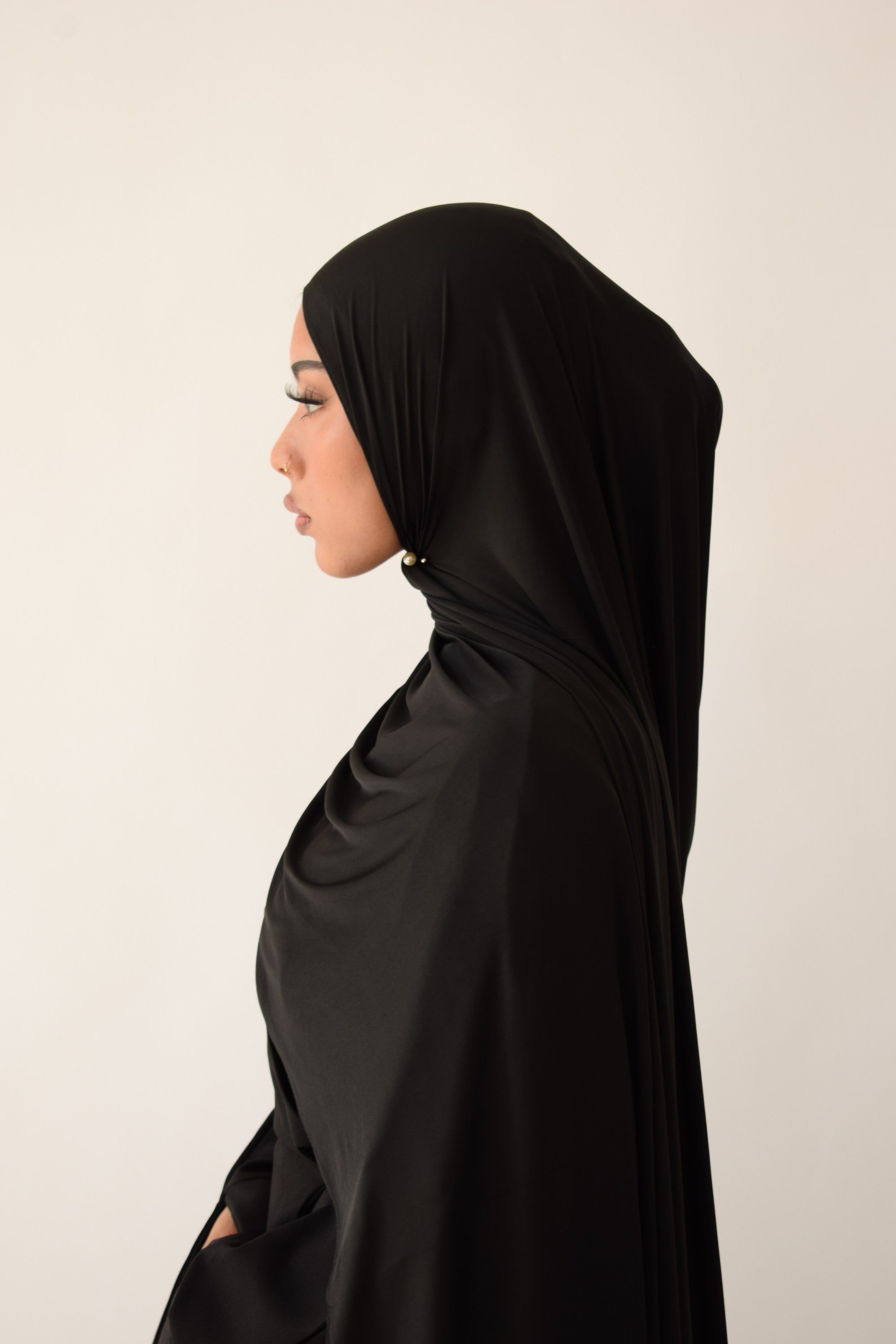 Black liquid jersey hijab draped and styled