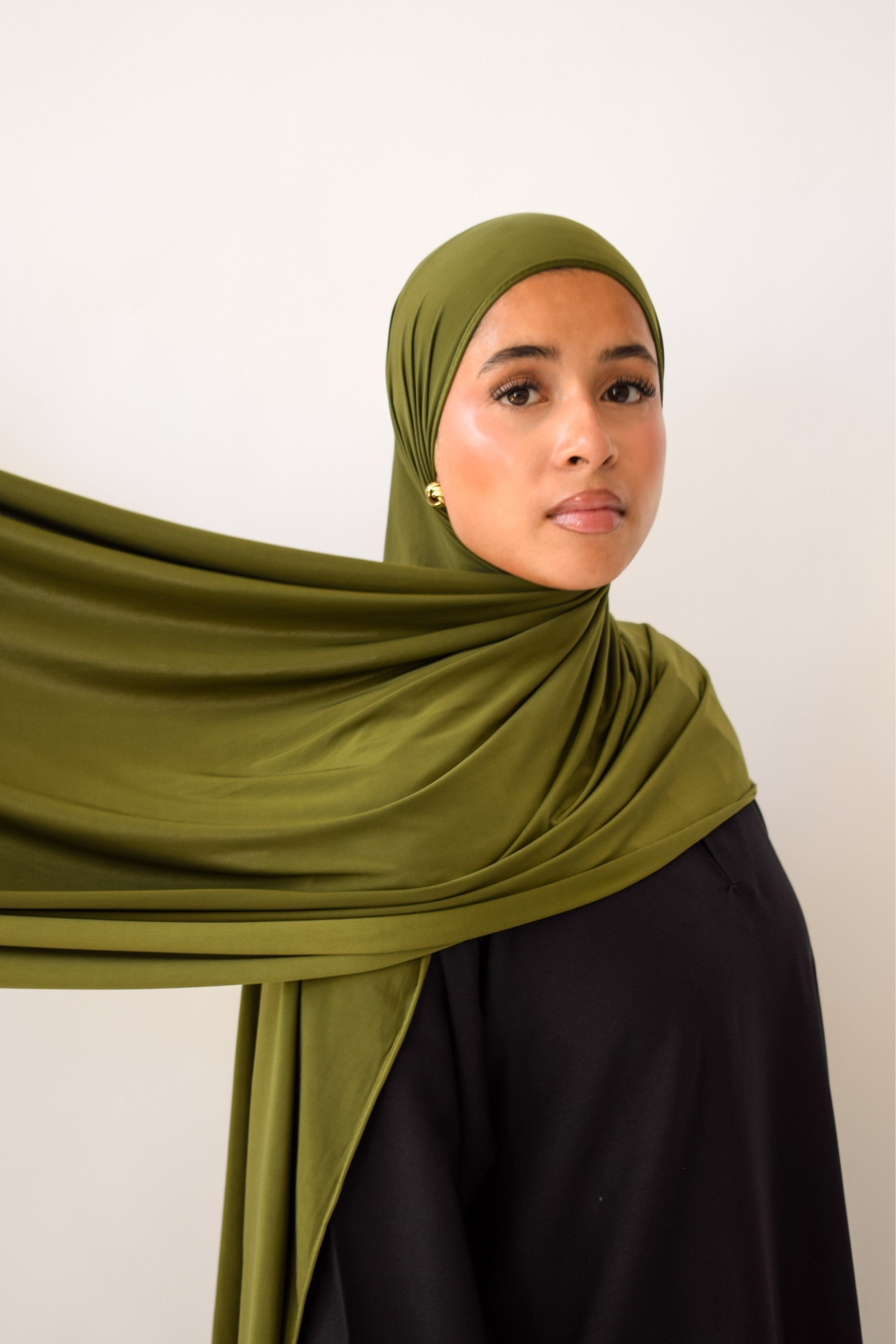 Olive liquid jersey hijab draped and styled